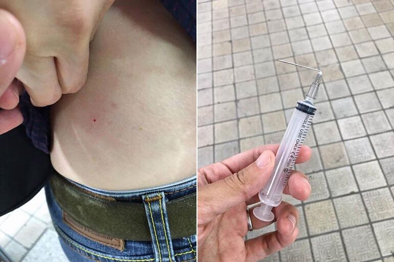 惊悚！韩国老妇街头将注射器刺入外国游客身体（组图）
